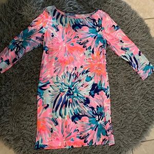 These are some dresses and they are some pink dresses wit sum blue and green